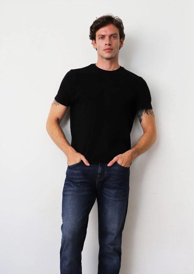 Example digital of a male model: natural light, plain background, no filters