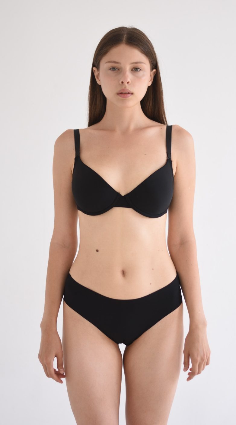 Half-body digital of a female model, front view, plain background